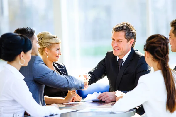 Image of business partners discussing documents and ideas at meeting — Stock Photo, Image