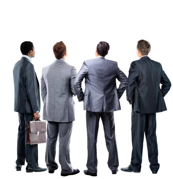 Four business mans from the back - looking at something over a white background — Stock Photo, Image