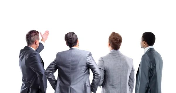 Cuatro hombres de negocios de la espalda mirando algo sobre un fondo blanco —  Fotos de Stock