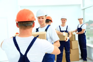 workers unload boxes clipart
