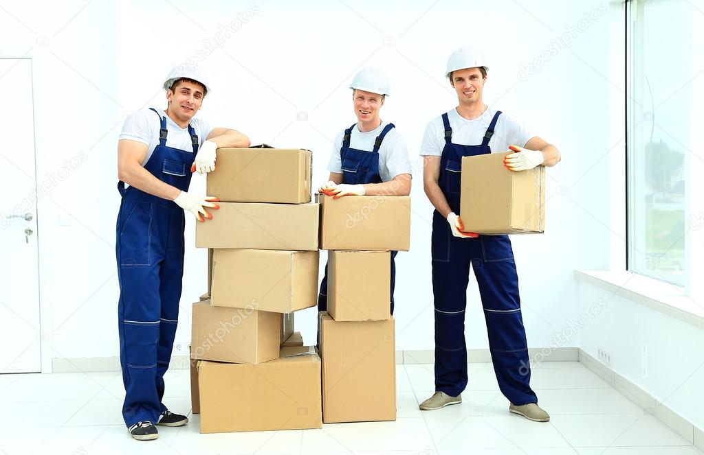 workers unload boxes