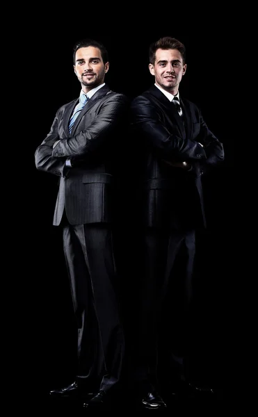 Two businessmen isolated over black background — Stock Photo, Image