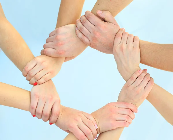 Ring of hands teamwork showing your product — Stock Photo, Image