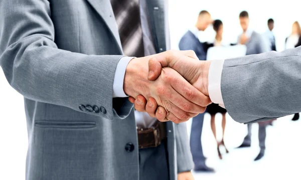 Business handshake e pessoas de negócios — Fotografia de Stock