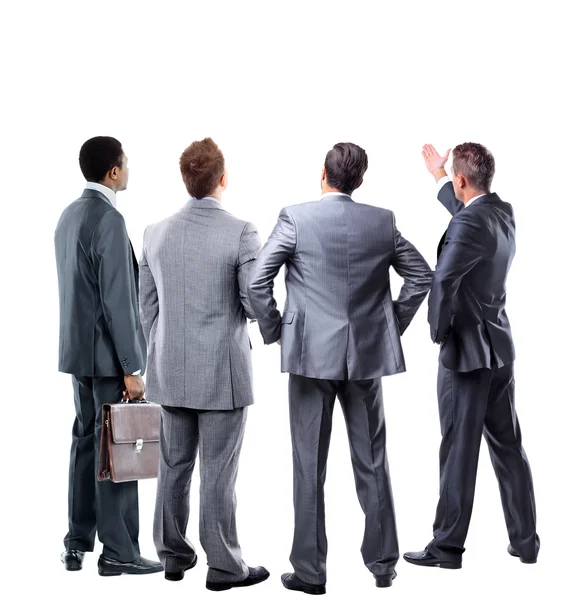 Cuatro hombres de negocios de la espalda mirando algo sobre un fondo blanco — Foto de Stock