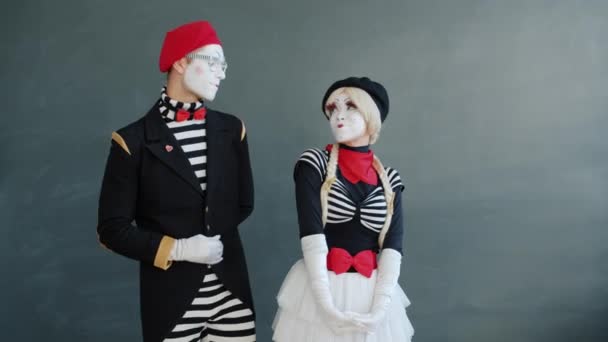 Portrait of happy girl mime getting flower from guy send air kiss smile at camera — Stok Video