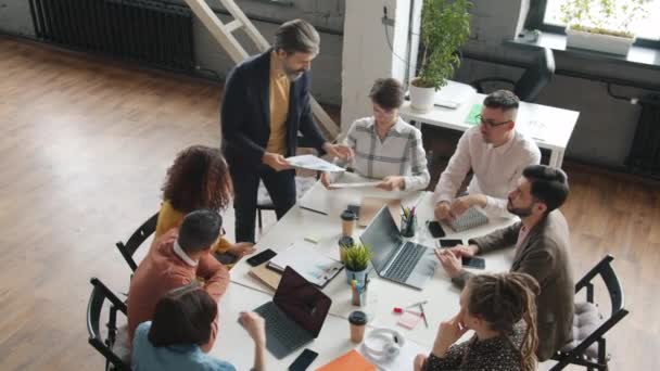 High angle view of creative business team discussing smartphone applications design in office — Stock Video