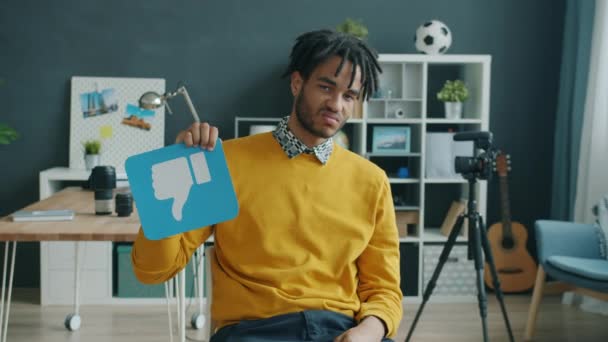 Slow motion portrait of African American blogger showing thumbs-down then thumbs-up hand gesture — Stock Video