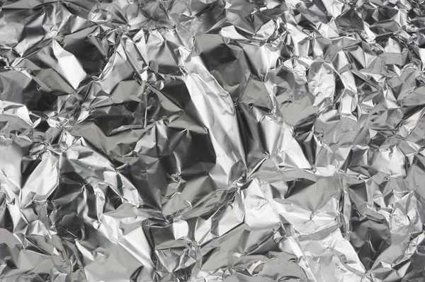 Zgnieciona folia aluminiowa jako tło — Zdjęcie stockowe