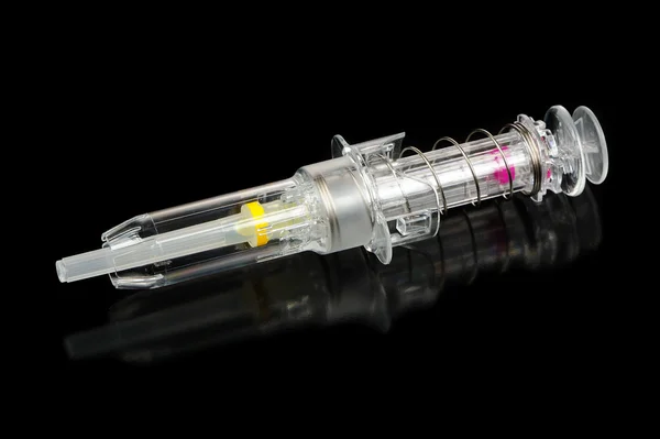 Modern Syringe with Automatic Safety System on Black Background — Stock Photo, Image