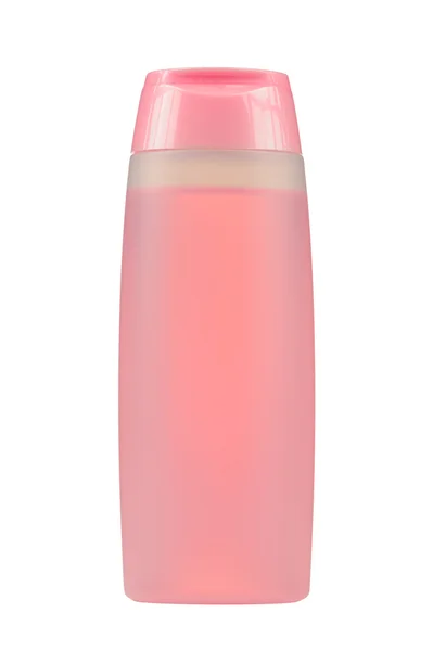 Косметическая бутылка с розовой жидкостью (тоник для лица) изолированы на белом фоне — стоковое фото