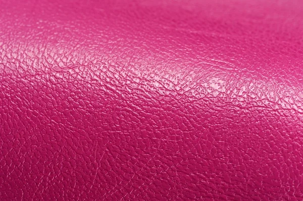 Ярко-розовый глянцевый искусственный кожаный фон текстура — стоковое фото