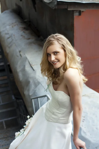 Young beautiful blonde woman in bridal dress — Stock Photo, Image