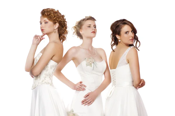 Portrait of a three beautiful woman in wedding dress isolated ov — Stock Photo, Image