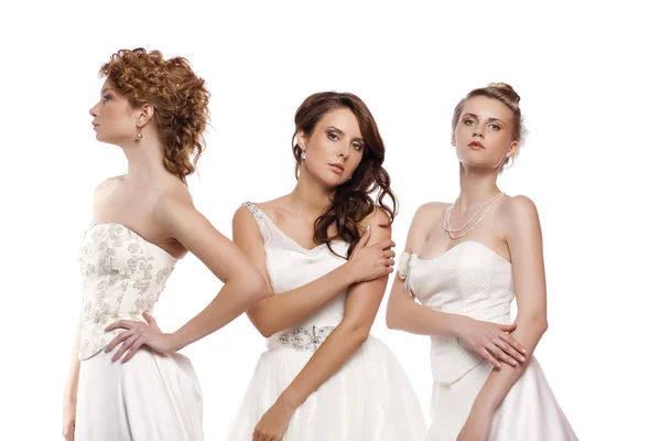 Esküvői ruha elszigetelt ov három gyönyörű nő portréja — Stock Fotó