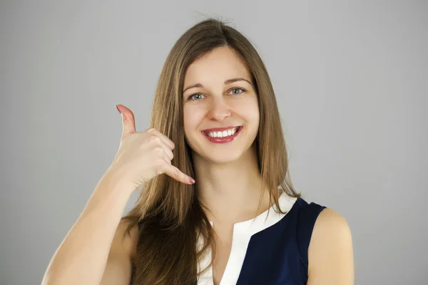 Happy woman making a call me gesture — Stock Photo, Image