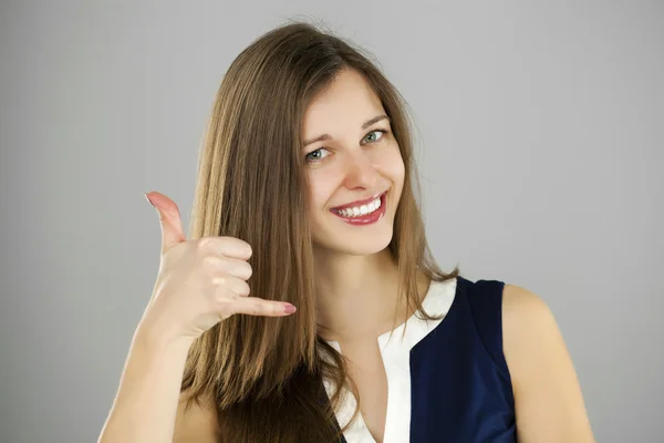 Happy woman making a call me gesture — Stock Photo, Image