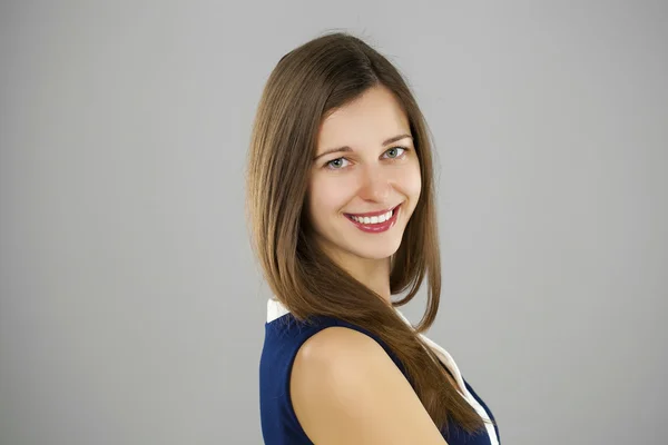 Beautiful woman face close up portrait young studio on gray — Stock Photo, Image