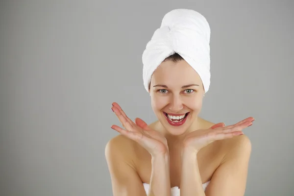 Beautiful young woman posing in white towel — Stock Photo, Image