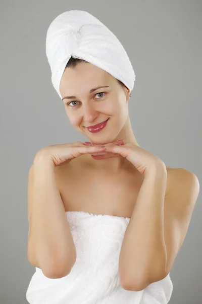 Beautiful young woman posing in white towel — Stock Photo, Image