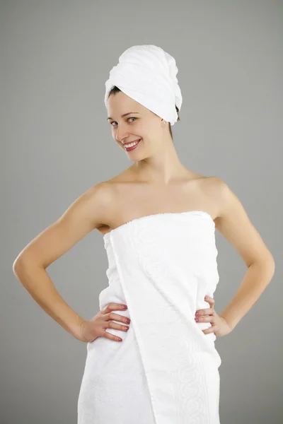 Beautiful young woman posing in white towel — Stock Photo, Image