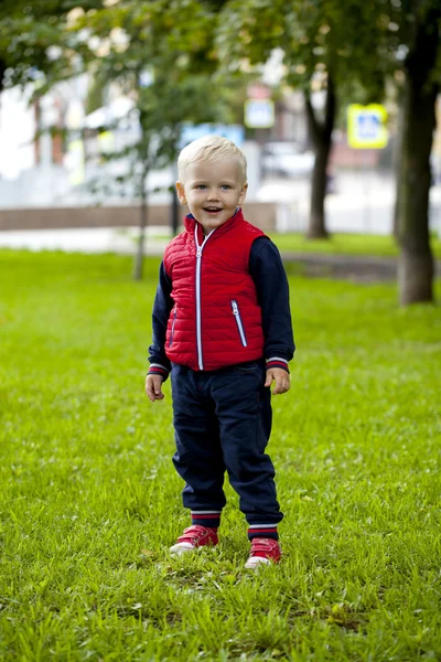 Blonde baby boy in  blue shirt and jeans — Stock Photo, Image