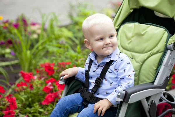 Little boy sitting in stroller — Stock Photo, Image