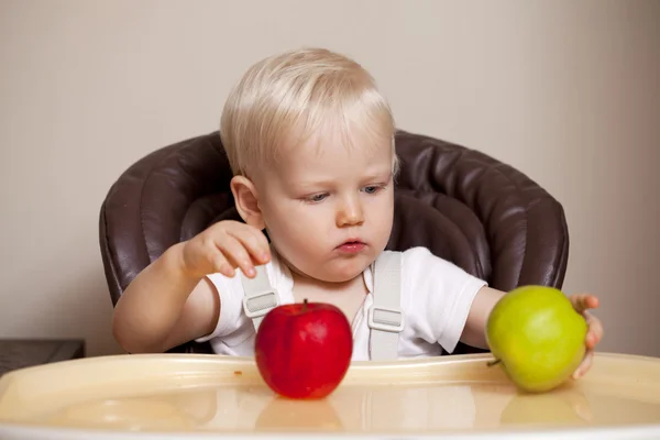 Two year baby boy sitting at the dinner table — Stock Photo, Image