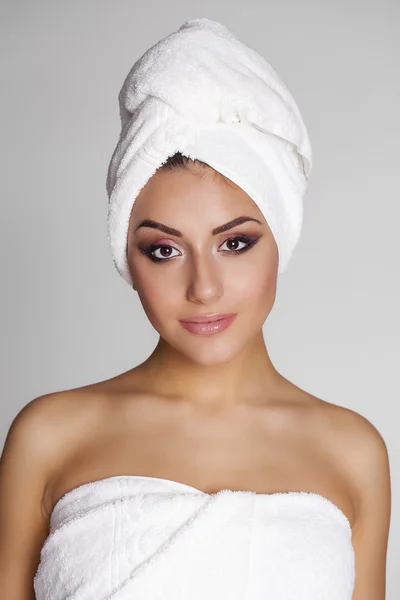 Beautiful young ethnic woman in white towel — Stock Photo, Image