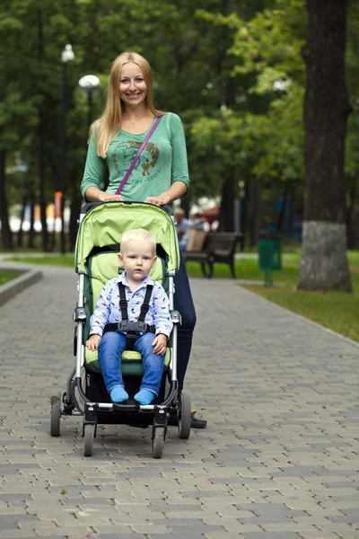 Mother with two year old son in summer park — Stock Photo, Image