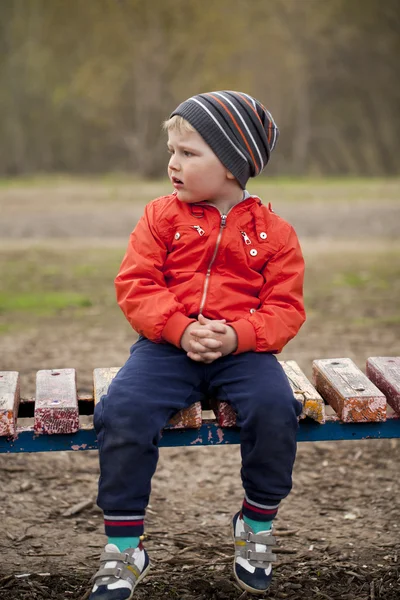 Baby boy in orange jacket — Stock Photo, Image