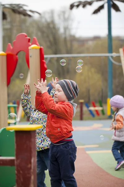 The three-year young boy on the playground — Stock Photo, Image