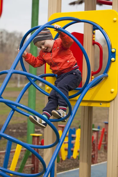 The three-year young boy on the playground Stock Photo