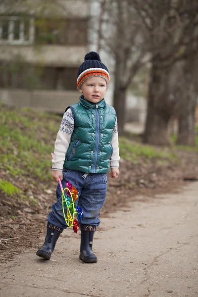 Baby boy in green jaket and blue jeans — Stock Photo, Image