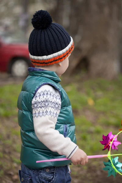 Baby boy in green jaket and blue jeans — Stock Photo, Image