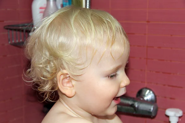 Curly wavy hair blond baby boy — Stock Photo, Image