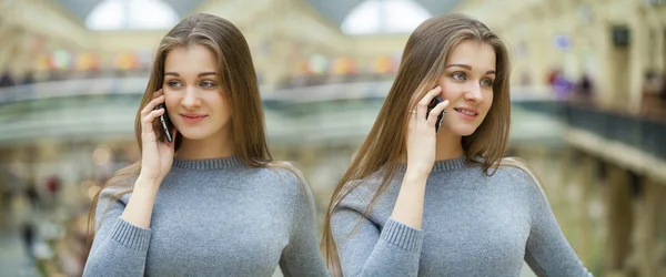 Mooie jonge brunette vrouw bellen via de telefoon — Stockfoto