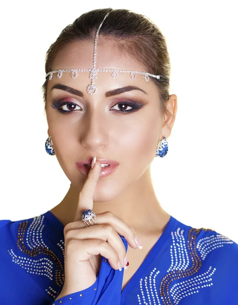 Portrait of attractive young woman with finger on lips — Stock Photo, Image