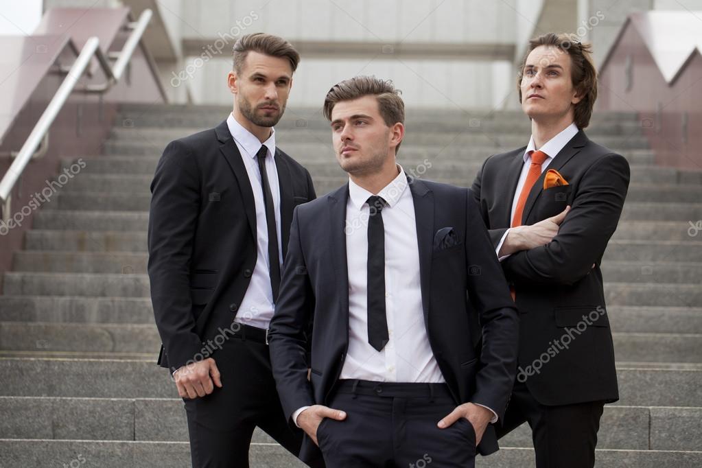 Three young men in elegant business suits — Stock Photo © arkusha