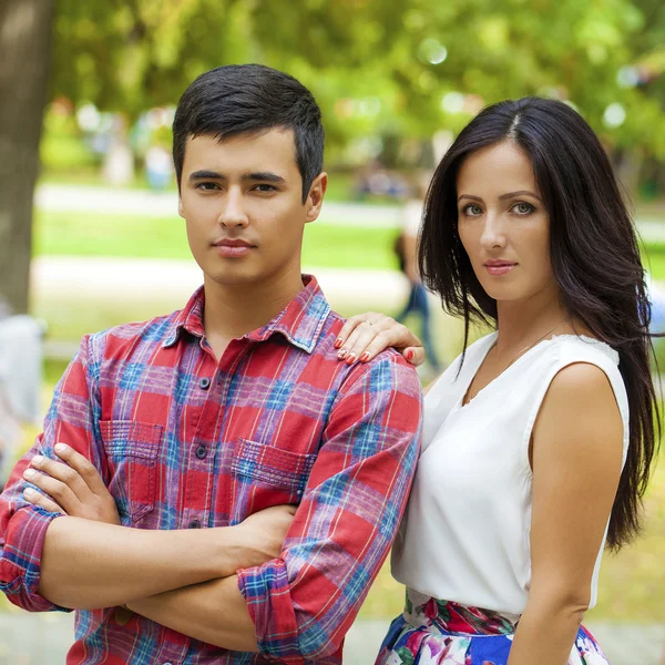 Beautiful young loving couple standing outdoors — Stock Photo, Image