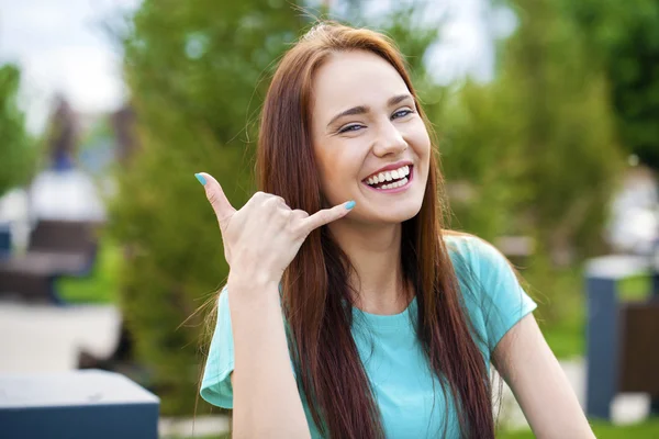 Beautiful woman making a call me gesture — Stock Photo, Image