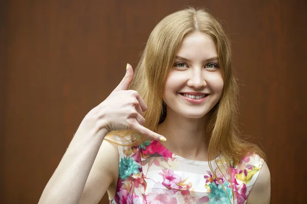 Beautiful woman making a call me gesture — Stock Photo, Image