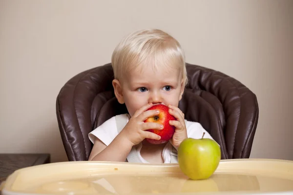 Two year baby boy sitting at the dinner table — Stock Photo, Image