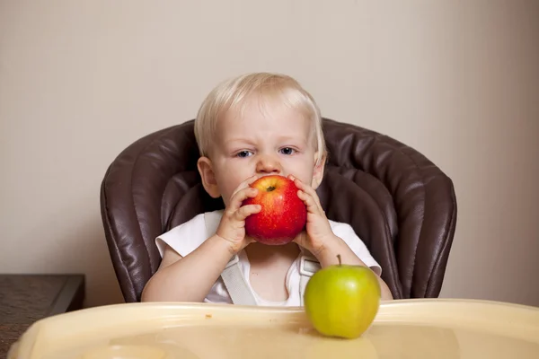 Two year baby boy sitting at the dinner table — Stock Photo, Image