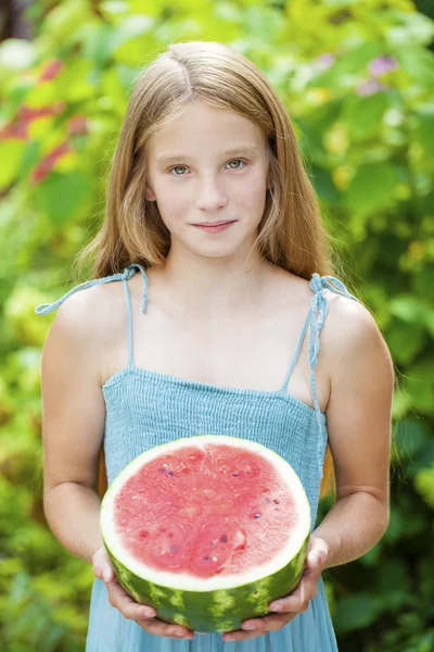 Portrait of a young little girl with watermelon — Stock Photo, Image