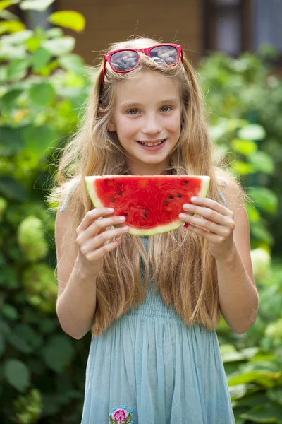 Portrait of a young little girl with watermelon — Stock Photo, Image