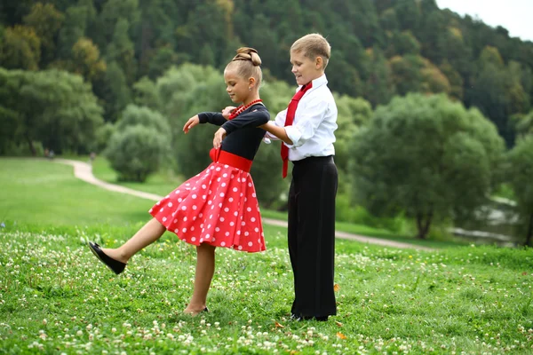 Little girl in a beautiful dress dancing — Stock Photo, Image