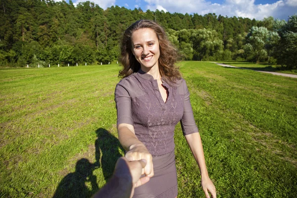 Follow me, Beautiful young woman holds the hand of a man — Stock Photo, Image