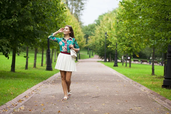 Young brunette woman in white skirt — Stock Photo, Image