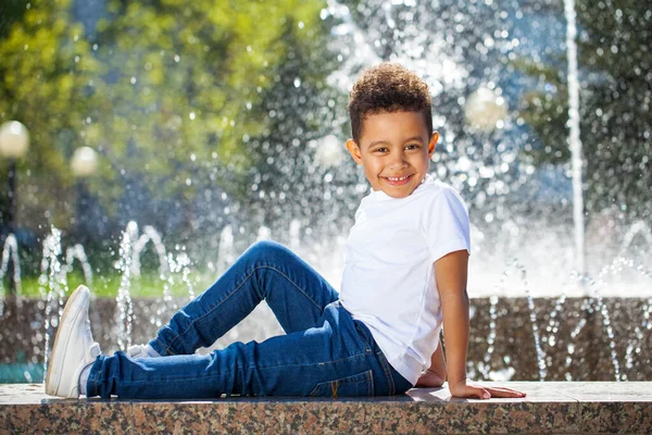 Five year old little boy in a summer park